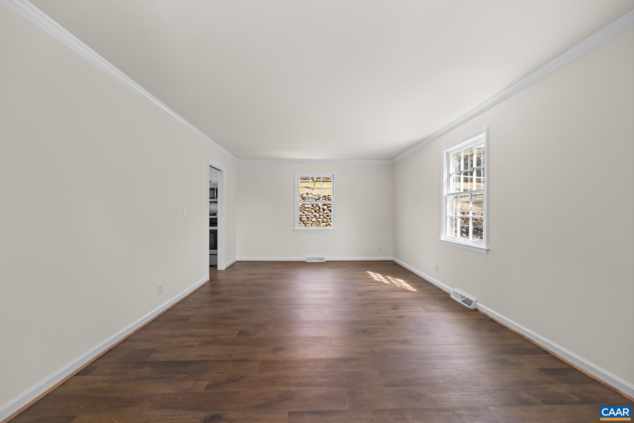 1941 Michael Place Charlottesville, VA 22901 - Photo 14 of 52 an empty room with wooden floor and windows
