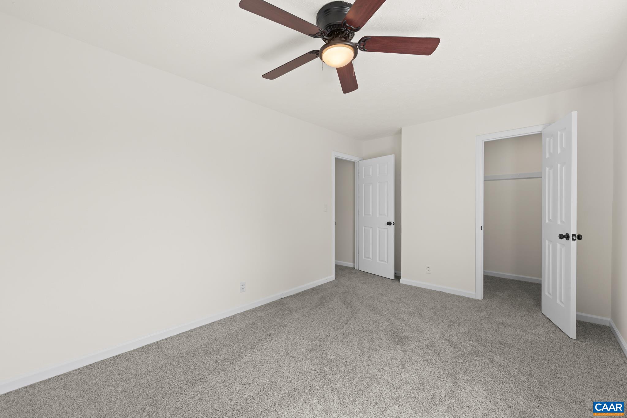 1941 Michael Place Charlottesville, VA 22901 - Photo 35 of 52 an empty room with closet and a chandelier fan