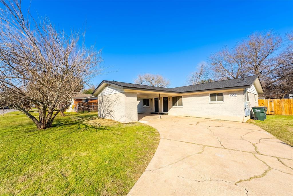 4306 Shallowbrook Trail Austin, TX 78744 - Photo 1 of 16 View of front of house featuring concrete driveway, brick siding, and a carport