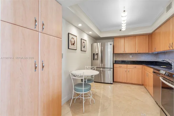 a spacious bedroom with a bed and a large window