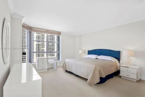 a bedroom with a bed and a window in it