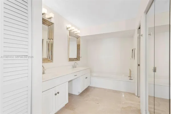 a bathroom with a shower and a sink