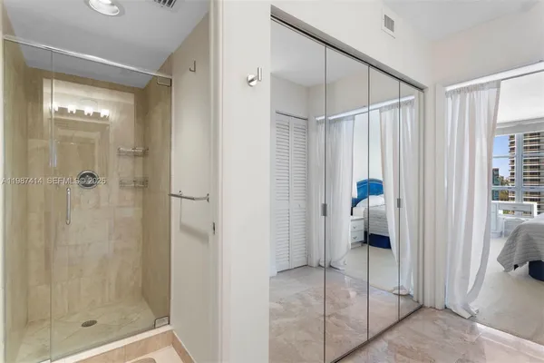 a bathroom with 2 sink tub and a mirror