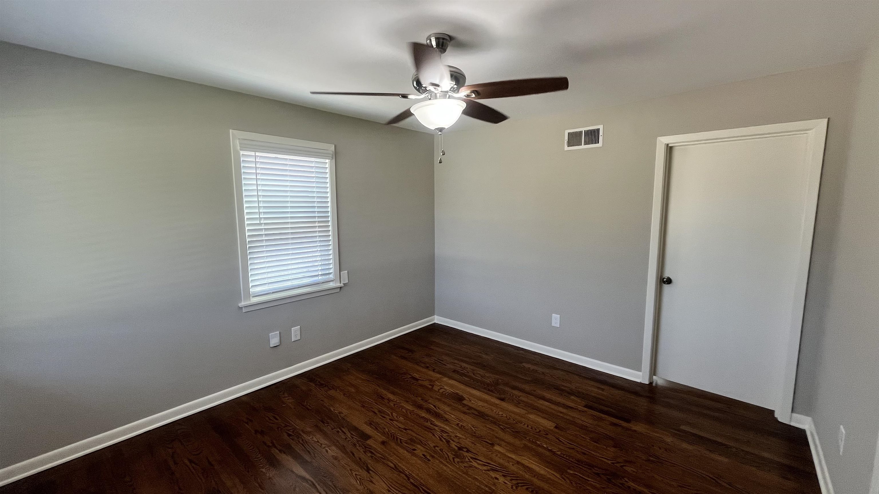 121 West Street Collierville, TN 38017 - Photo 7 of 16 wooden floor in an empty room with a window
