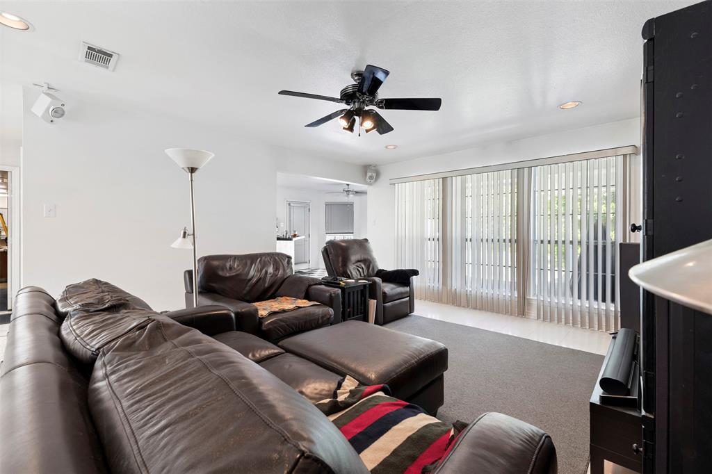 401 Rugged Drive Red Oak, TX 75154 - Photo 14 of 40 Living area featuring a ceiling fan with integrated lighting, recessed lighting, and wall-mounted speakers