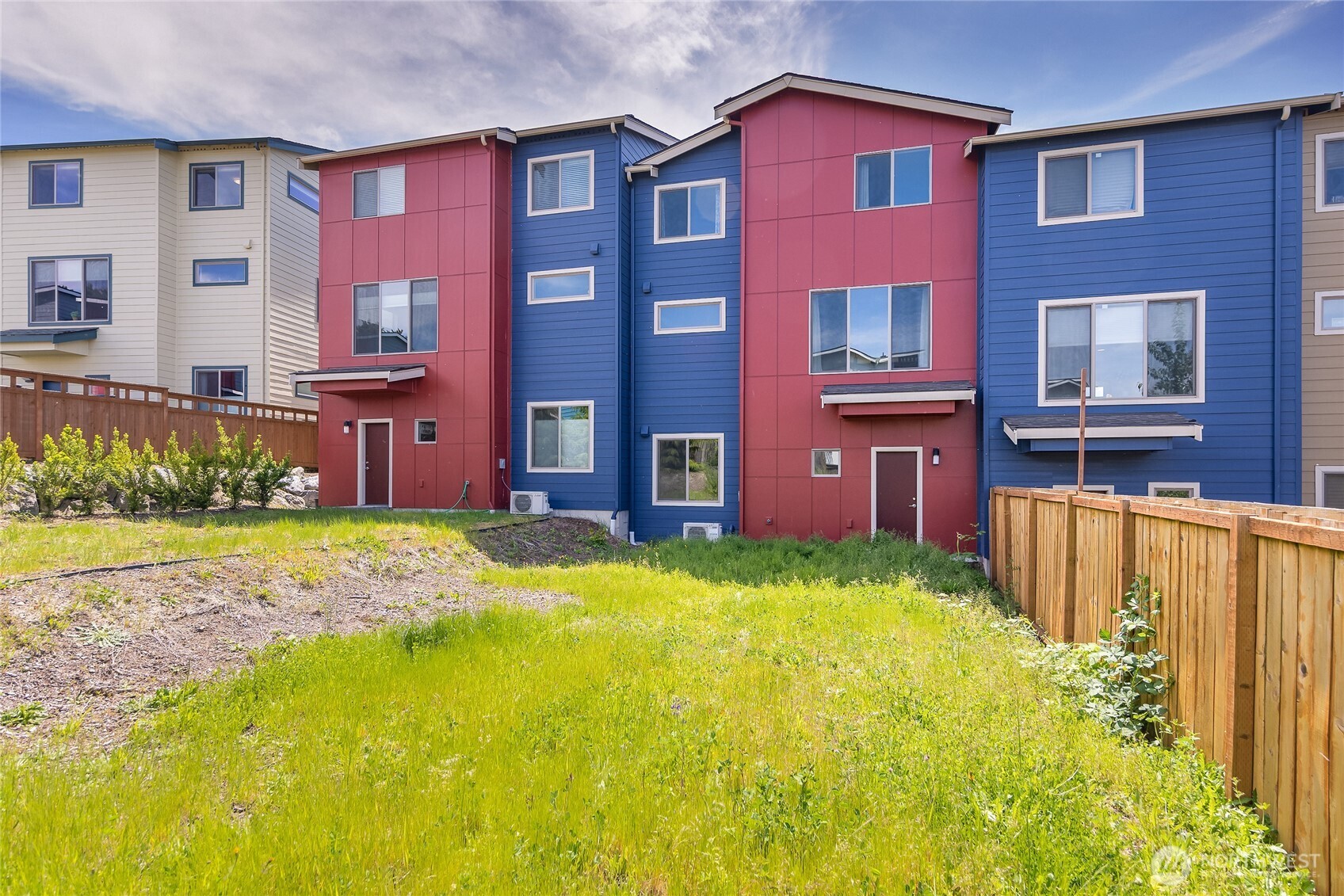 1066 Southwest 99th Place, Unit 55 Seattle, WA 98106 - Photo 2 of 21 a view of a house with a yard