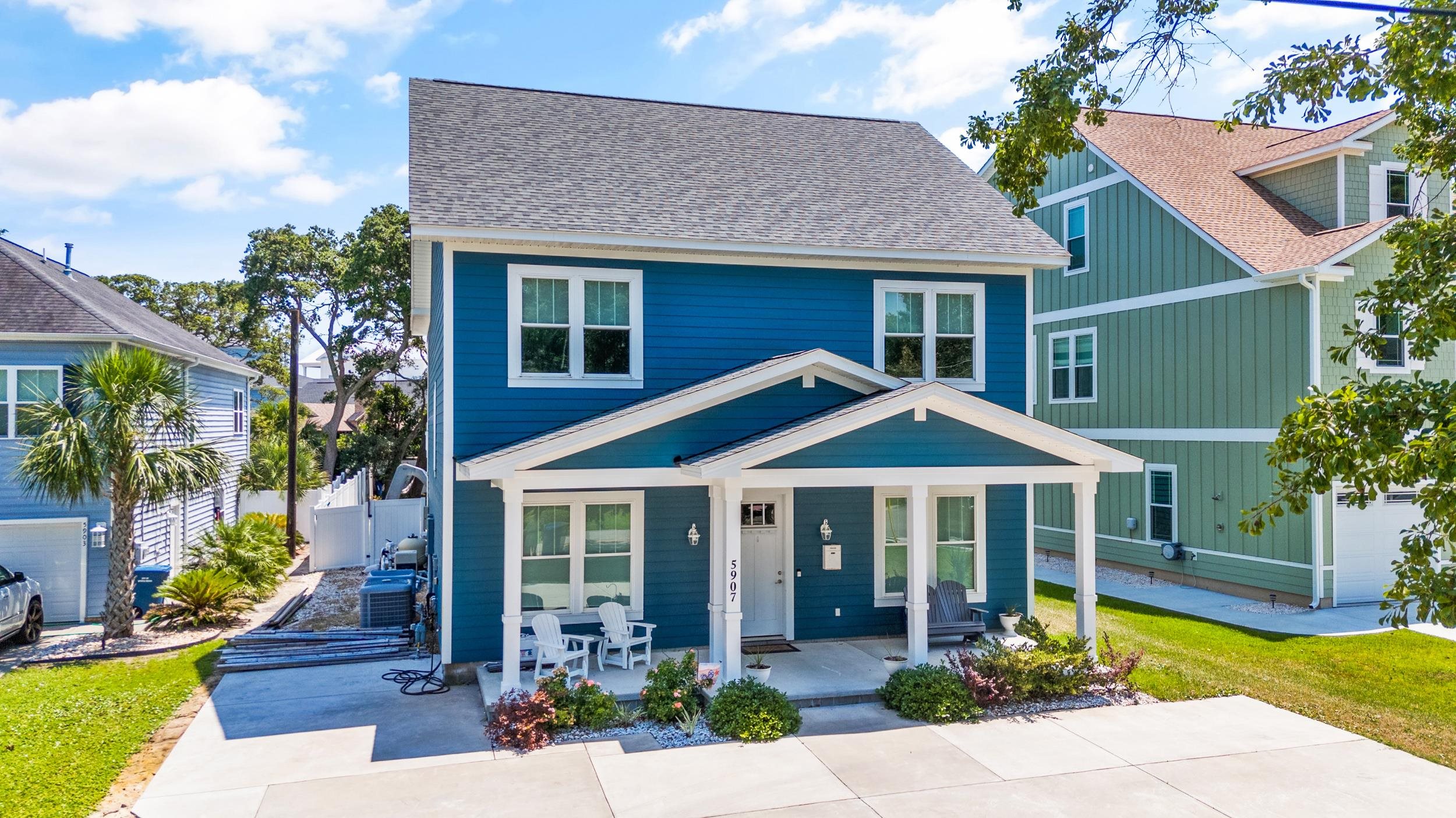 View of front of home featuring a porch and a shingled roof
