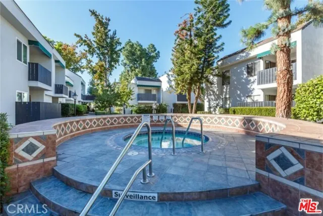 a view of a pathway both side of house