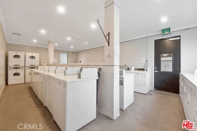 a living room with furniture potted plant and a window