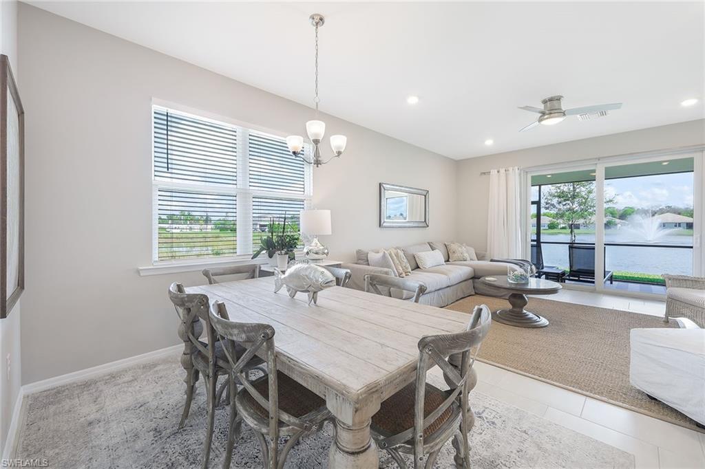 1114 Tranquil Brook Drive Naples, FL 34114 - Photo 13 of 32 a view of a dining room with furniture window and outside view
