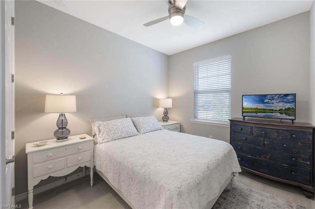 1114 Tranquil Brook Drive Naples, FL 34114 - Photo 17 of 32 a bedroom with a bed and a window