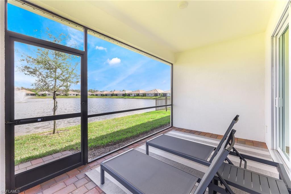 1114 Tranquil Brook Drive Naples, FL 34114 - Photo 21 of 32 a view of a room with wooden floor and windows