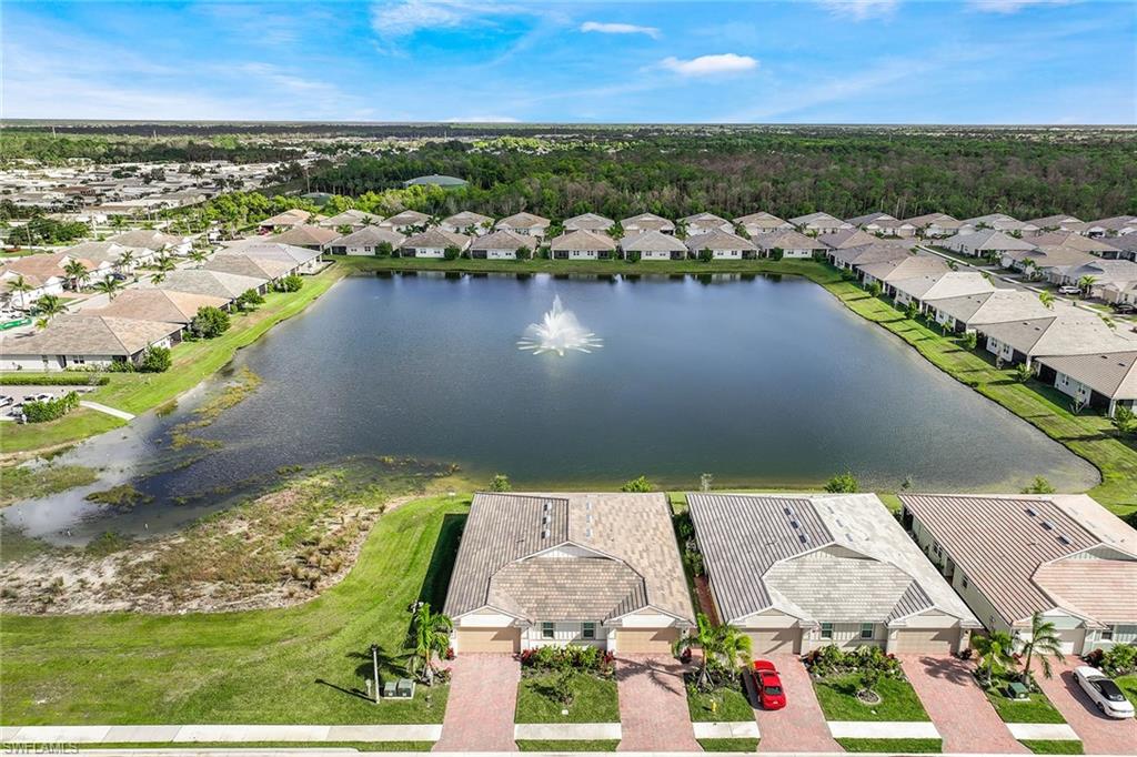 1114 Tranquil Brook Drive Naples, FL 34114 - Photo 25 of 32 an aerial view of residential houses with outdoor space
