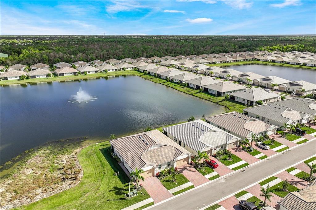 1114 Tranquil Brook Drive Naples, FL 34114 - Photo 26 of 32 an aerial view of a house with a lake view