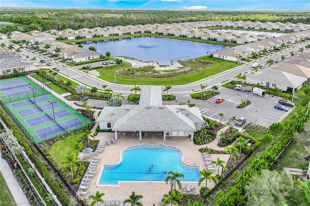 1114 Tranquil Brook Drive Naples, FL 34114 - Photo 27 of 32 an aerial view of a house with a swimming pool