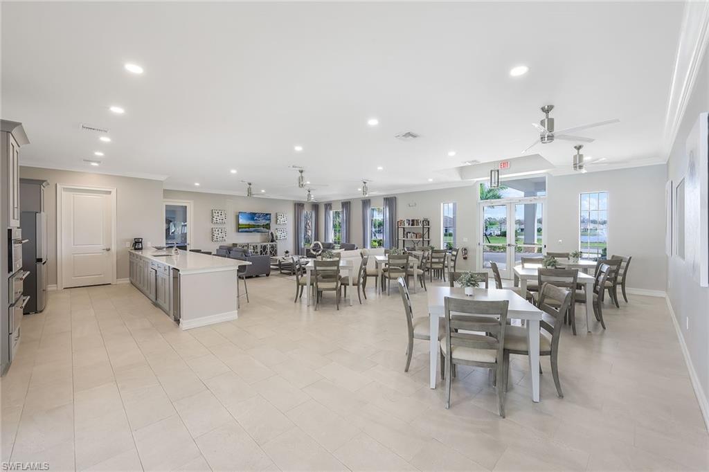 1114 Tranquil Brook Drive Naples, FL 34114 - Photo 29 of 32 a view of a dining area with furniture