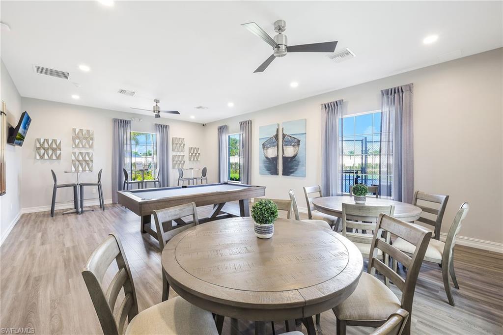 1114 Tranquil Brook Drive Naples, FL 34114 - Photo 31 of 32 a view of a a dining room with furniture window and wooden floor