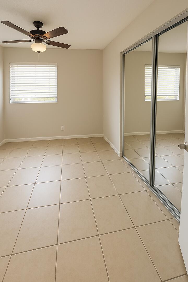 4670 Northeast 5th Avenue, Unit 15 Boca Raton, FL 33431 - Photo 4 of 9 a view of an empty room with a window
