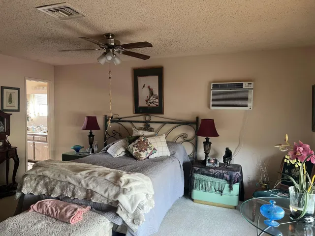 a bedroom with bed and a window