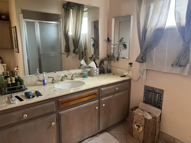 a bathroom with a sink and a mirror