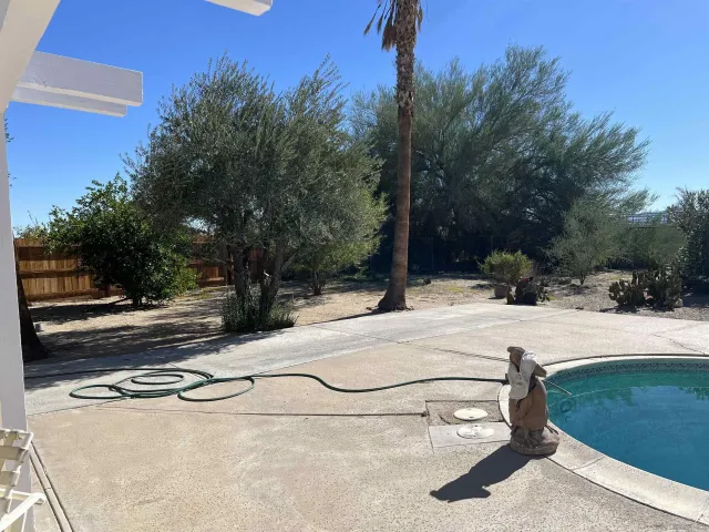 a view of a yard with table and chairs