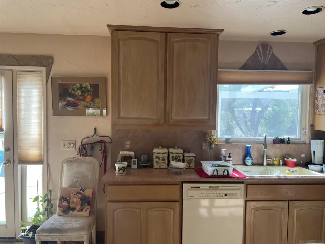 a kitchen with a sink and cabinets