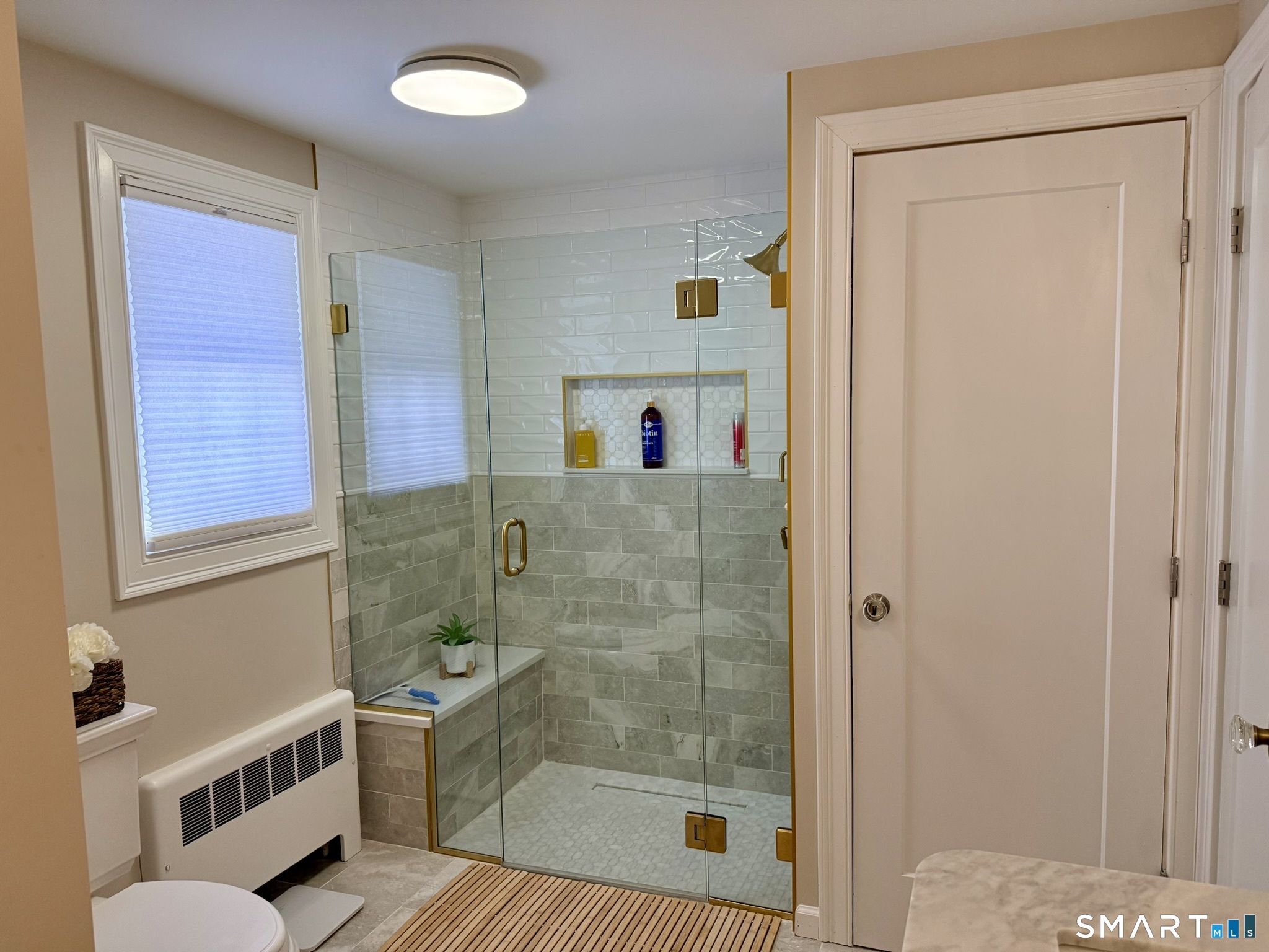 24 Elm Street Wethersfield, CT 06109 - Photo 13 of 24 a bathroom with a bathtub and a shower