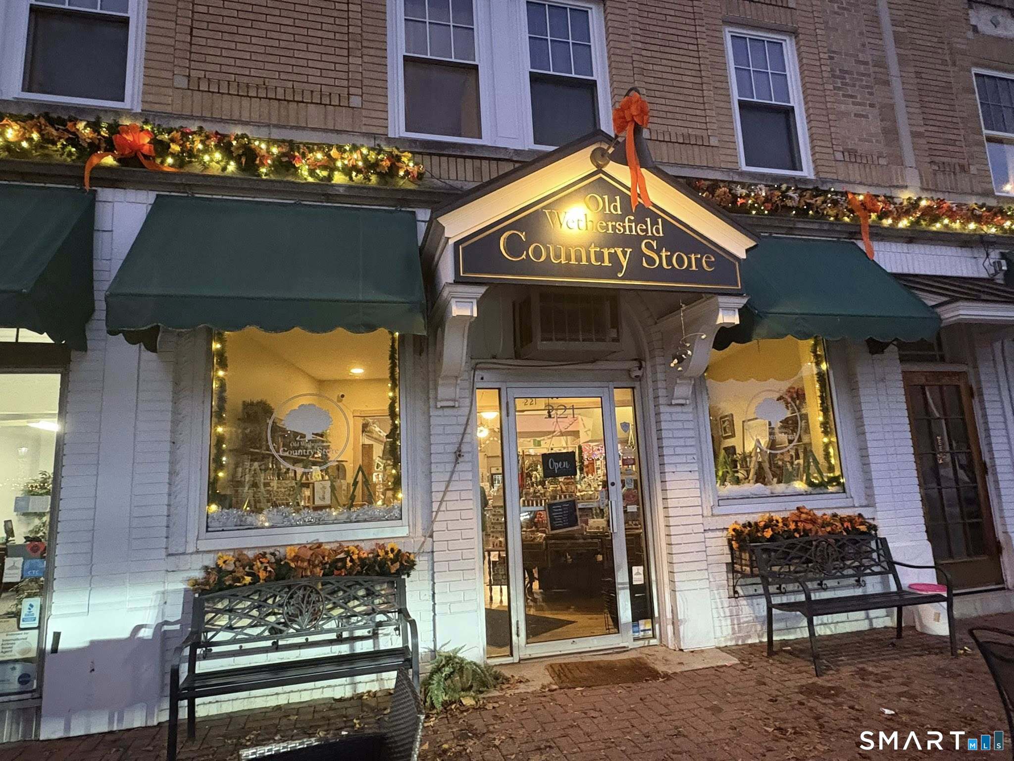 24 Elm Street Wethersfield, CT 06109 - Photo 19 of 24 a view of brick building with a bench in front of building