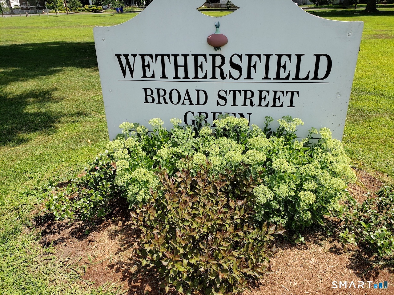 24 Elm Street Wethersfield, CT 06109 - Photo 24 of 24 a sign broad in front of the house
