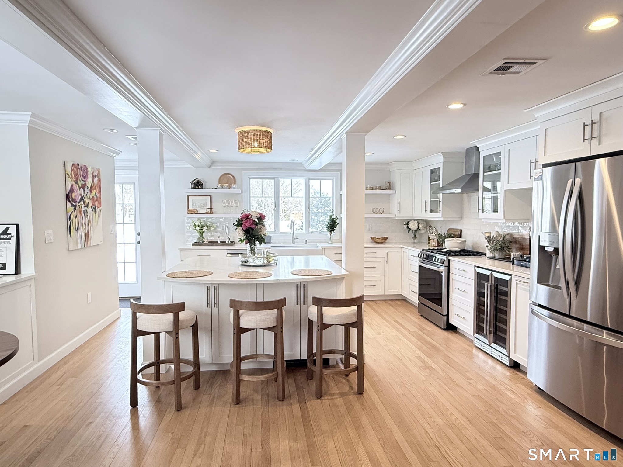 24 Elm Street Wethersfield, CT 06109 - Photo 3 of 24 a kitchen with stainless steel appliances a dining table chairs refrigerator and sink