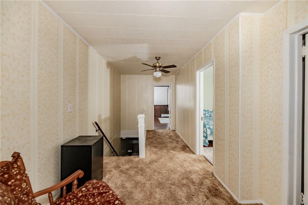 234 6th Street Clymer, PA 15728 - Photo 18 of 29 a living room with a couch and a chandelier