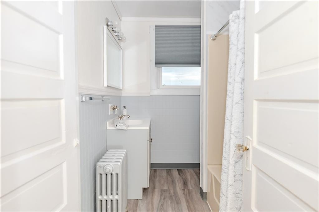 234 6th Street Clymer, PA 15728 - Photo 9 of 29 a bathroom with a sink a mirror and a shower