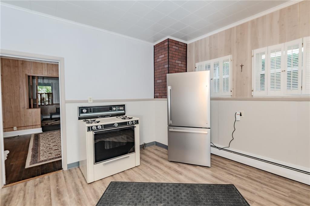 234 6th Street Clymer, PA 15728 - Photo 10 of 29 a white refrigerator freezer and a stove sitting inside of a kitchen