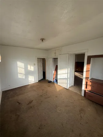 a view of empty room and a window