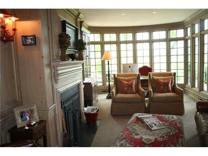 638 Backbone Road Sewickley Heights, PA 15143 - Photo 12 of 25 Den. Cozy den with a wall of windows and fireplace for cold winter nights.