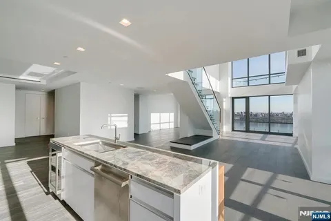 a kitchen with a stove and a sink