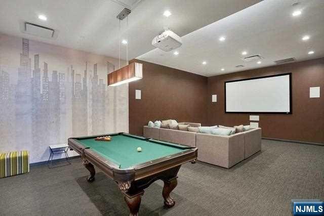 320 Adolphus Avenue, Unit 316 Cliffside Park, NJ 07010 - Photo 26 of 34 a living room with furniture and a pool table