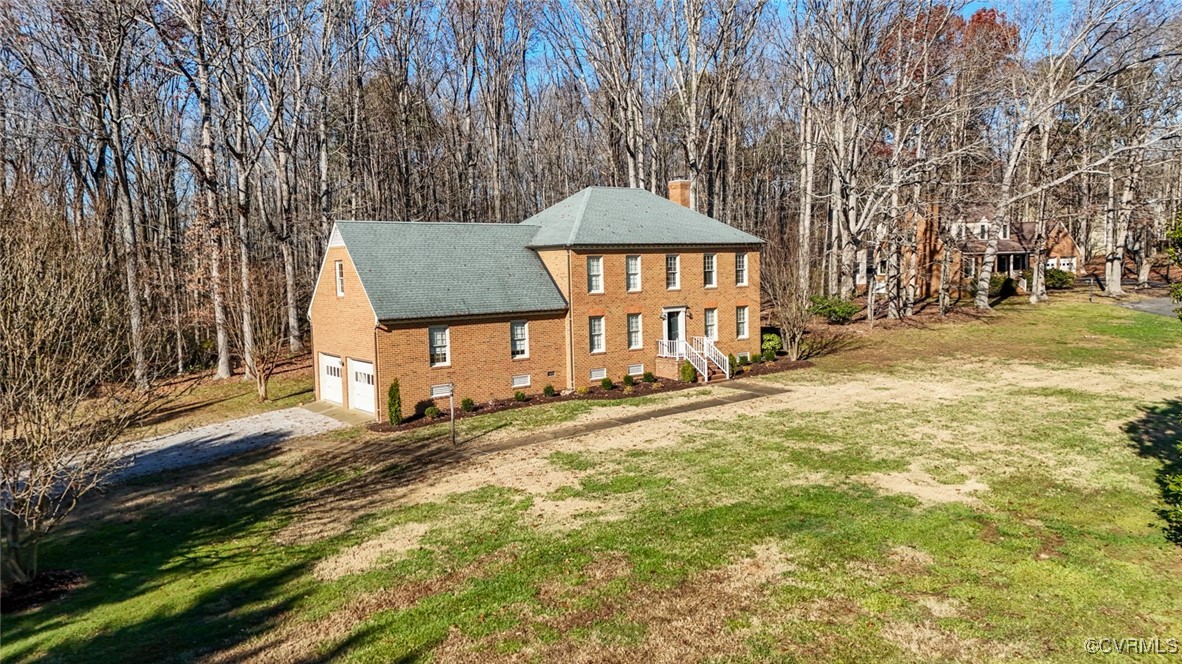 550 Fords Road Manakin-Sabot, VA 23103 - Photo 3 of 45 View of side of property with a lawn and a garage