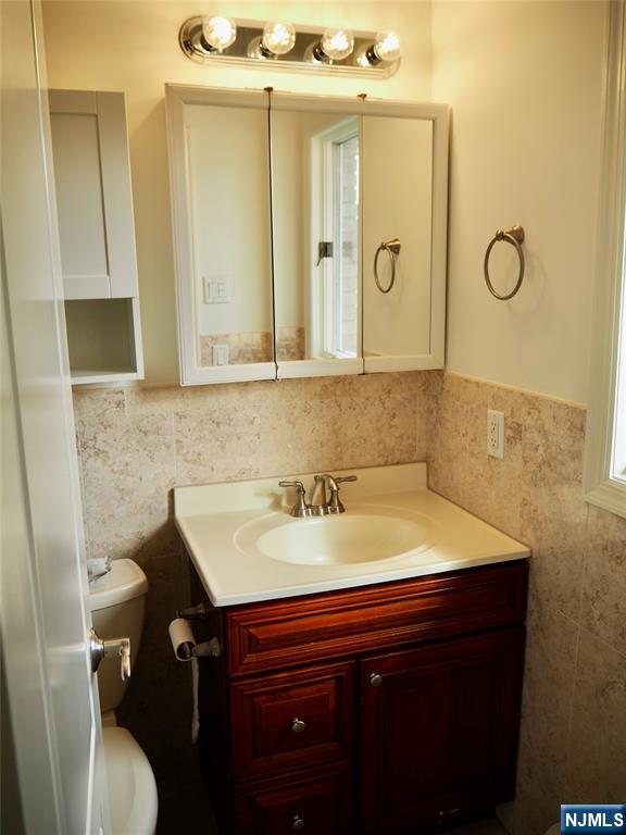 744 Hamilton Avenue, Unit 1 Ridgefield, NJ 07657 - Photo 14 of 29 a bathroom with a sink and a mirror