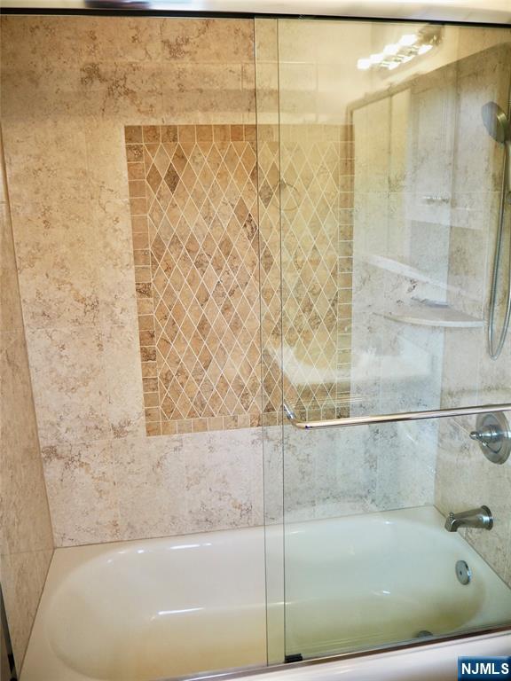 744 Hamilton Avenue, Unit 1 Ridgefield, NJ 07657 - Photo 15 of 29 a bathroom with a bathtub and shower