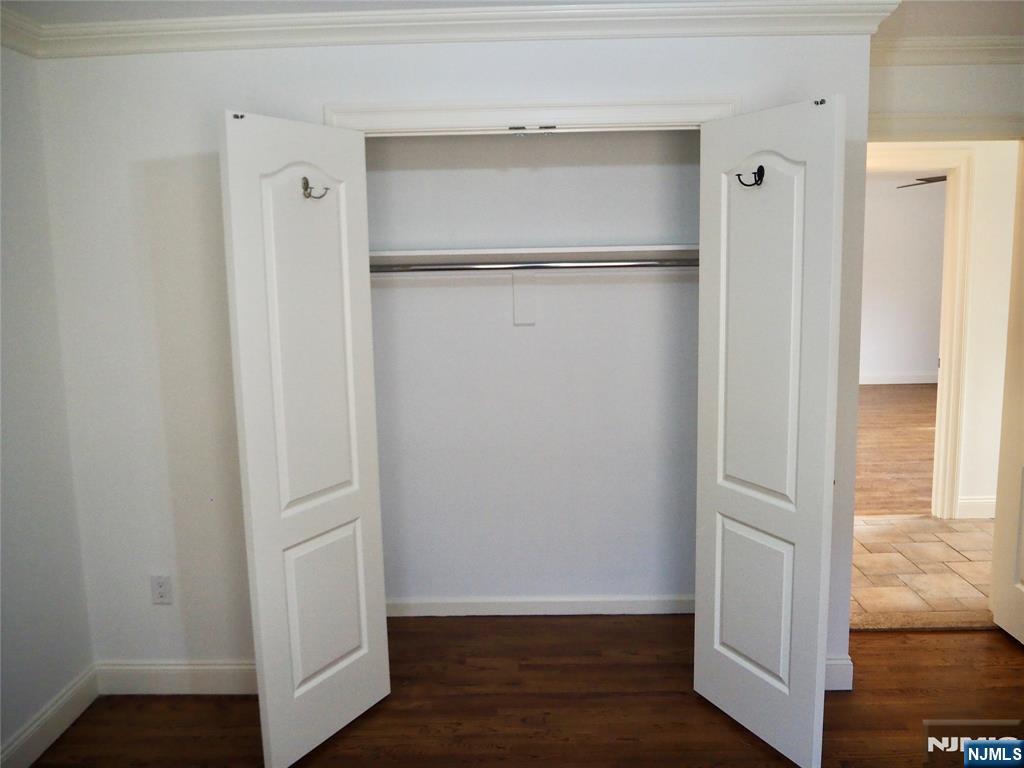 744 Hamilton Avenue, Unit 1 Ridgefield, NJ 07657 - Photo 17 of 29 a view of walk in closet with empty racks