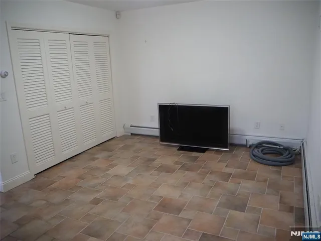 a bathroom with a granite countertop shower