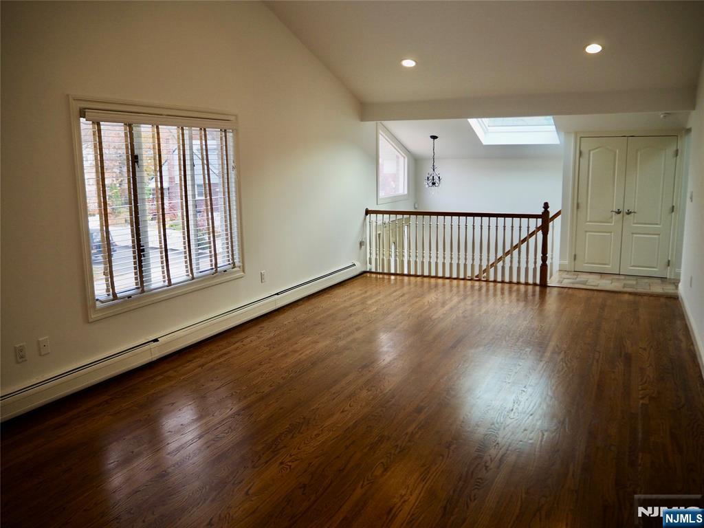 744 Hamilton Avenue, Unit 1 Ridgefield, NJ 07657 - Photo 8 of 29 a view of staircase with wooden floor and windows
