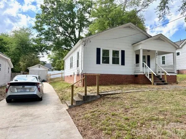 a car parked in front of a house