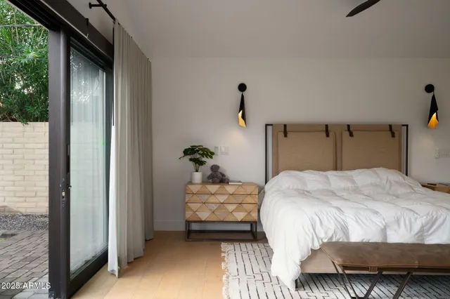 a bedroom with a bed and a dresser