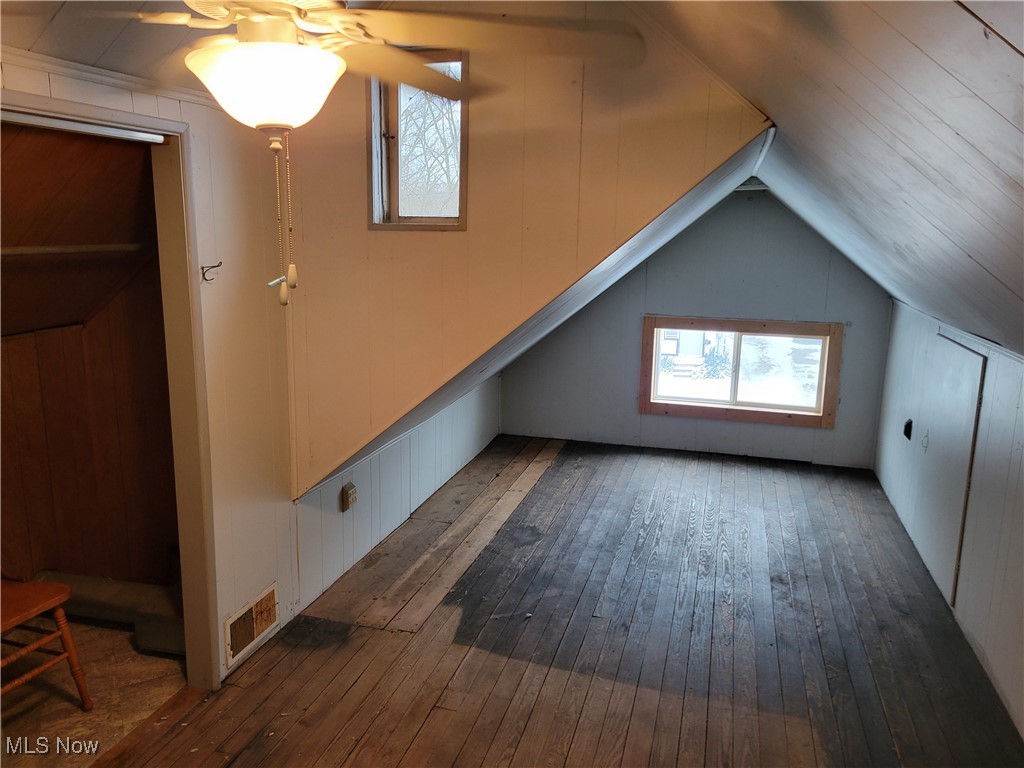 1263 West Waterloo Road Akron, OH 44314 - Photo 13 of 21 Bonus room with hardwood / wood-style floors and vaulted ceiling