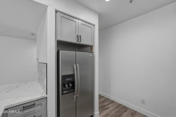 a kitchen with a sink stove and refrigerator