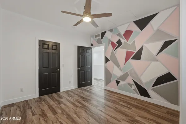 a view of room with window and ceiling fan