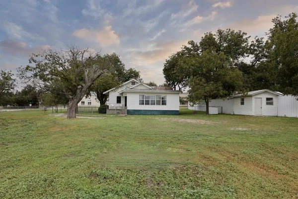 a view of a backyard with a garden