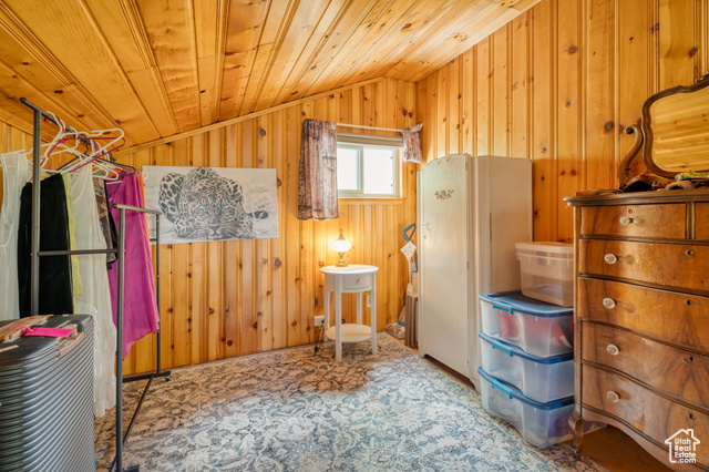 714 Spotted Fawn Way Kamas, UT 84036 - Photo 18 of 34 Bedroom featuring lofted ceiling, wood walls, and wood ceiling